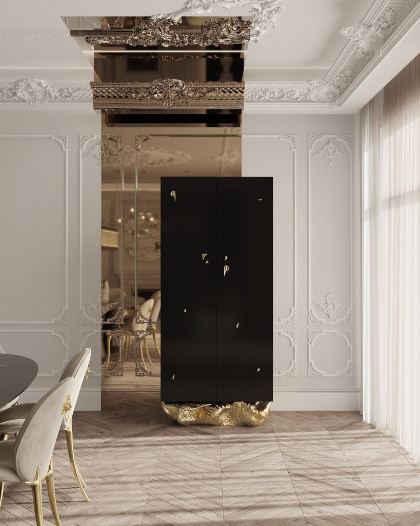 Vintage Inspired- Dining room with light walls, with a miroor included. We can see a center table and a black cabinet with brass underneath